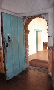 rectangular door and an arched doorway
