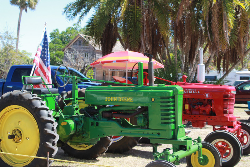 the tractors with the meeting hall in the background