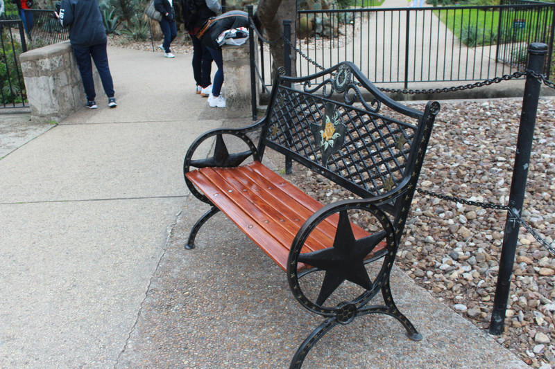 a Texas bench complete with the lone star and the yellow rose