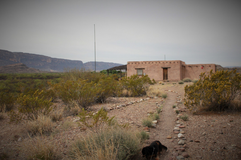 an old farmstead with Santa Elena Canyon in the background