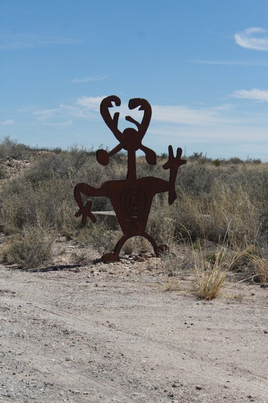 further down the road a cut out of a petroglyph