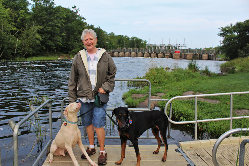 Ginnie with Linus and Alfy by the dam