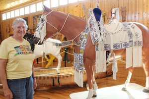 Ginnie with a well beaded horse