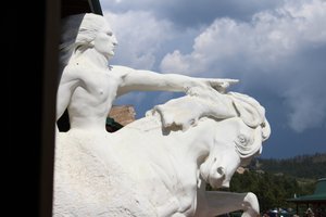 the sculpture under his arm