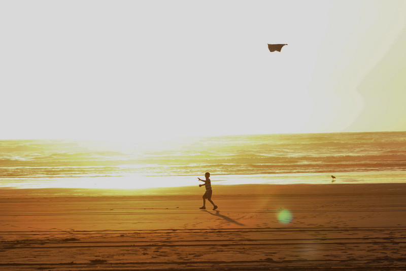 sunset, a little boy and a kite