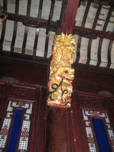 Gold sculptures on the ceiling beams
