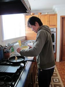 Lie Wei making banana pancakes for breakfast