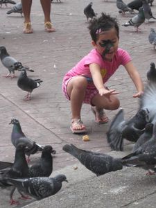 She had some kind of deformity on her face, but her joy with the birds was beautiful
