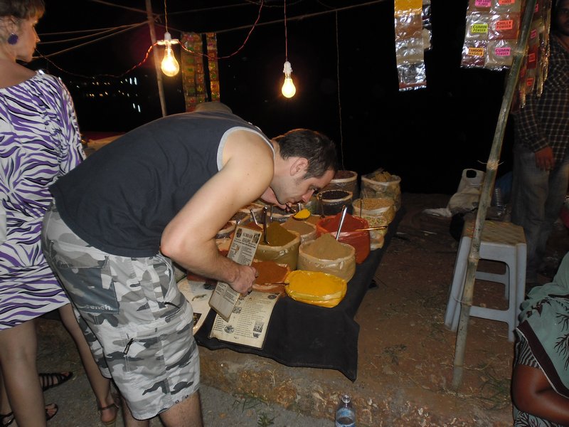Rich smelling the spices