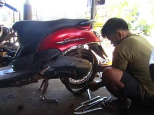 Mechanic fixing our bike in Ko Lanta
