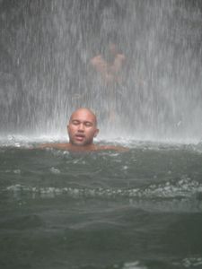 Anton swimming through the waterfall