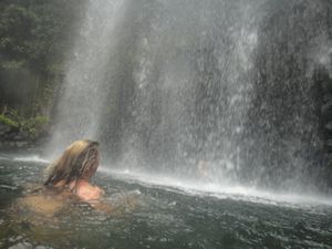 Kate swimming through the waterfall