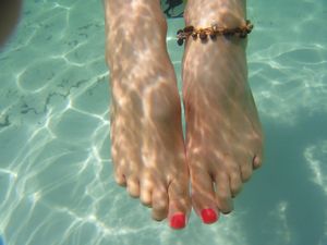 Kate's toes in the clear water of Lake McKenzie