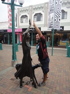 Anton high fiving the statue