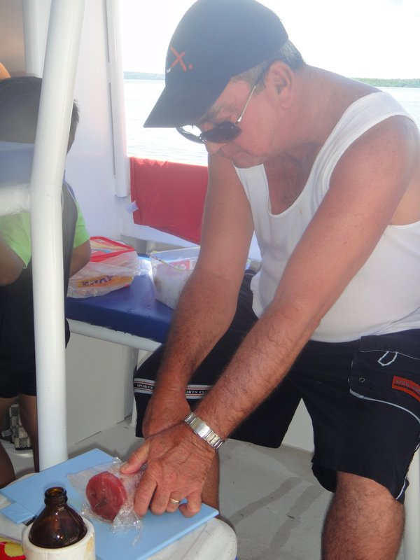 Unlce Geoff cutting the raw fish