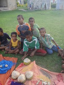 Children selling coconuts