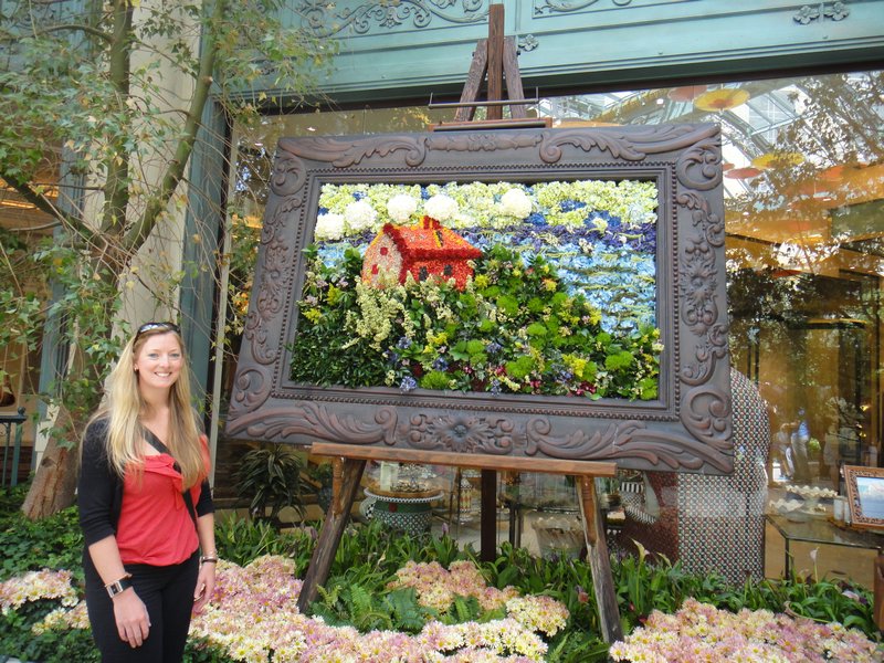 Kate with a picture made of flowers