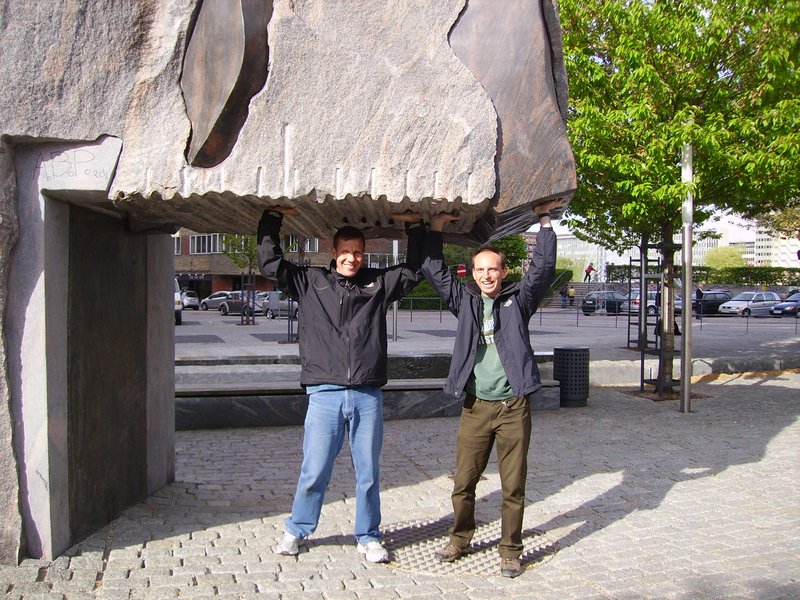 My host and me lifting a huge stone...