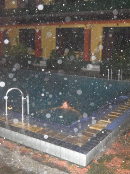 Matt naked in the pool as it rains!