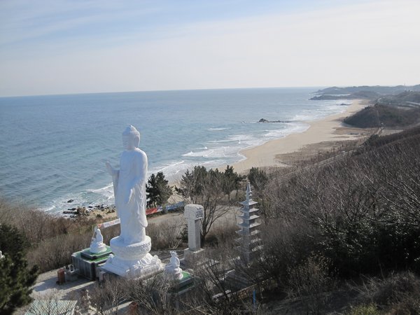 Some beach and giant statue.