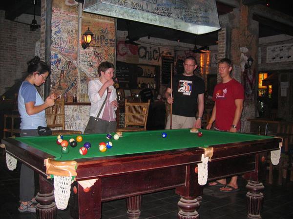 Playing pool at the bar