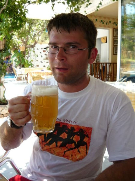 Alex enjoying a cold beer after a grueling walk to Stegna beach
