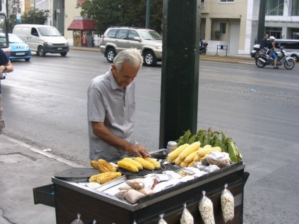 Roasted corn vendor at the bus tsop.