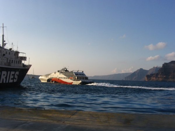 A sister hydrofoil boat departs