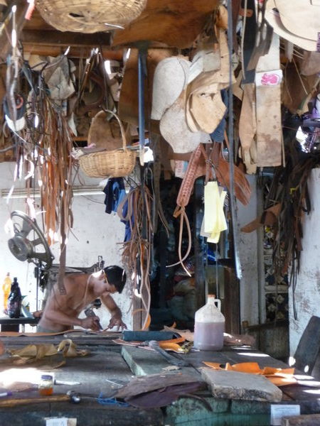 Boys at work in the saddle shop