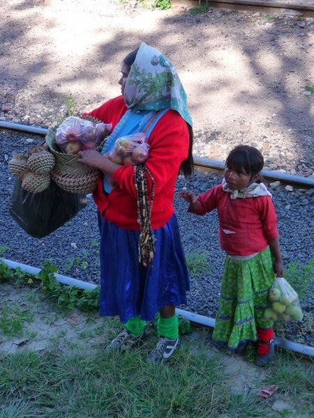 Selling apples and crafts to the passengers