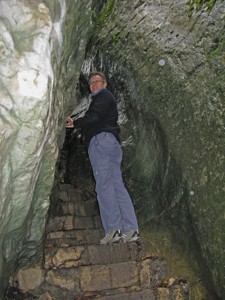 Trish climbing through the rock