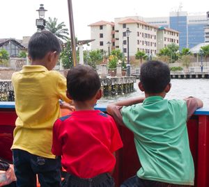 Boys enjoying the boat ride