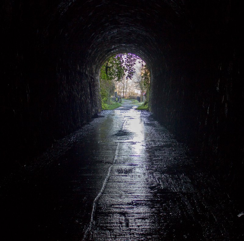 Dark railway tunnels on the footpath