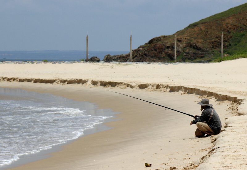 Fisherman on OUR beach!
