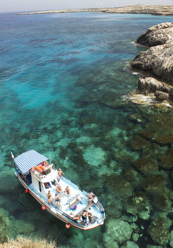 A tourist boat near Cap Greco