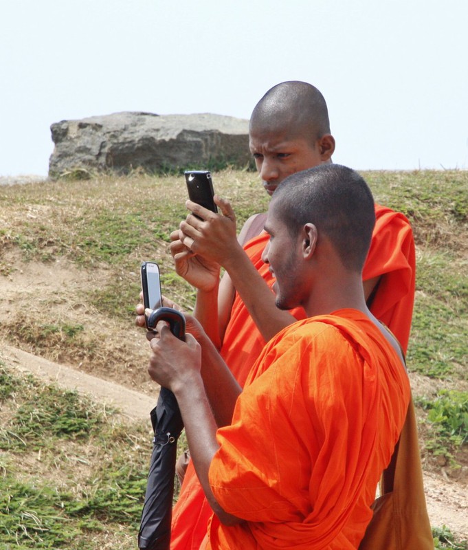 Monks taking photos