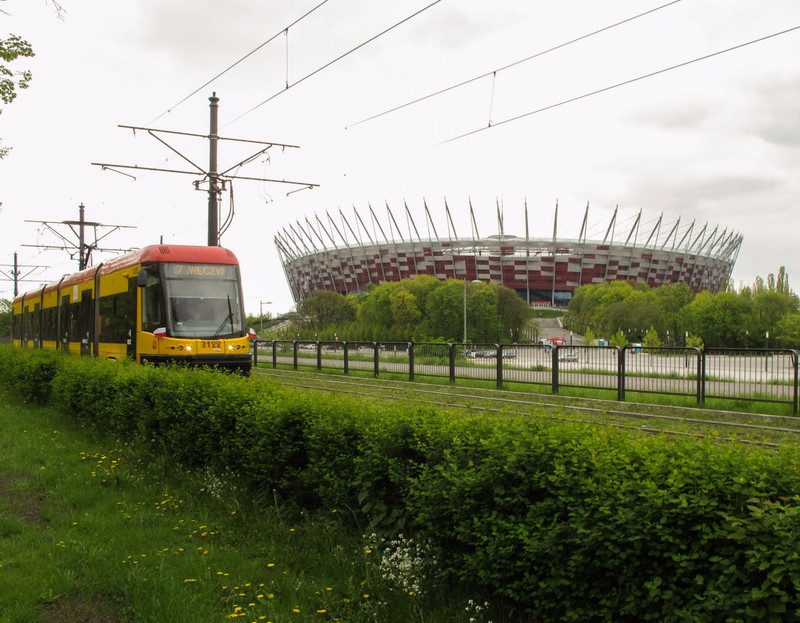 Modern tram passes the National Stadium