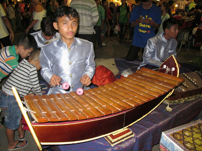 Playing at the night market
