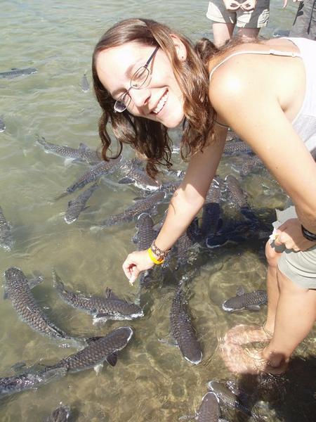 Claire feeding the fish at AquaScene