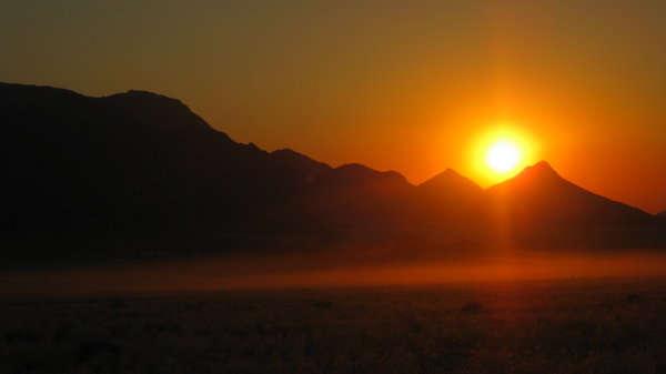 Sun setting behind Brandberg Mountain | Photo