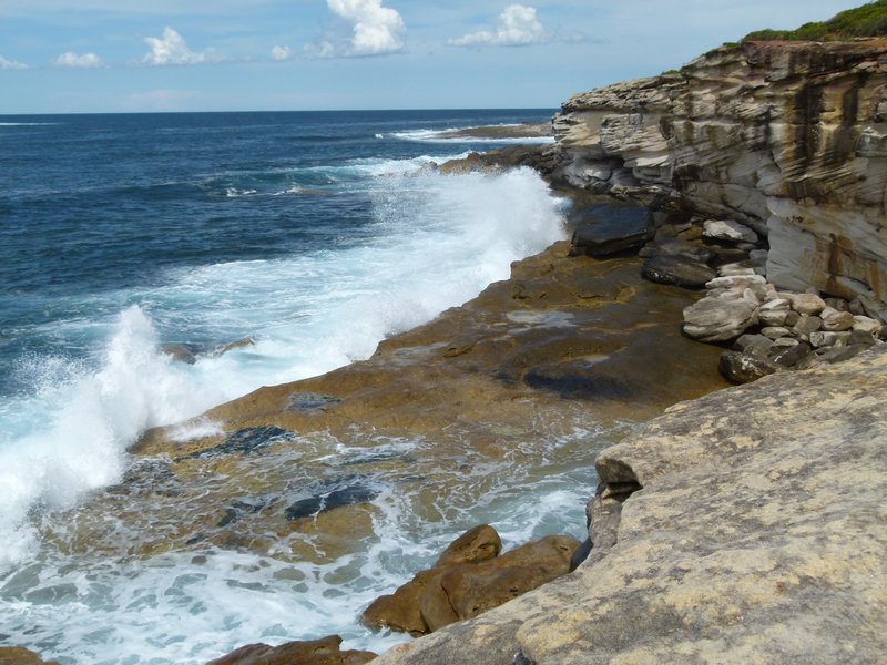 Waves crashing against the coast