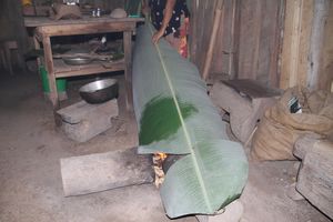 Making cup from banana leaf