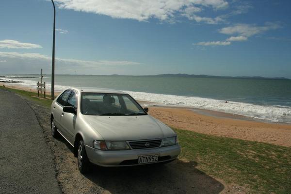 One of the countless beaches ... and our first car.