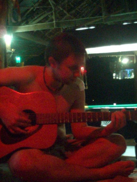 David playing the guitar at the Monkey Bar