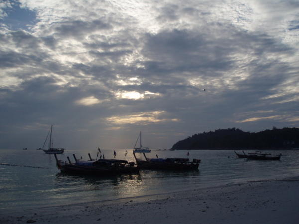 More boats on the beach at dusk