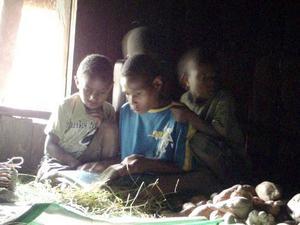 The village children were fascinated by the book we had borrowed about their local area