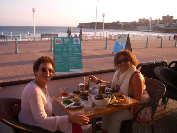 Mum and I witrh our mammoth feast of a dinner at Bondi Beach