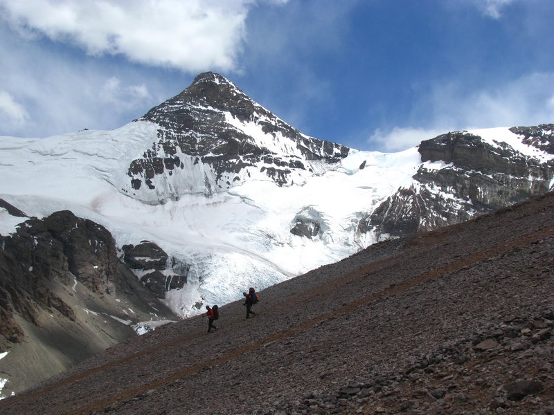 Climbers Desecending Against  Cerro Cuerno's Constant Presence