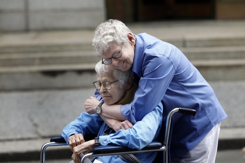 Phyllis Siegel, 76, left, and Connie Kopelov, 84, both of New York, embrace after becoming the first same-sex couple to get married at the Manhattan City Clerk's office.
