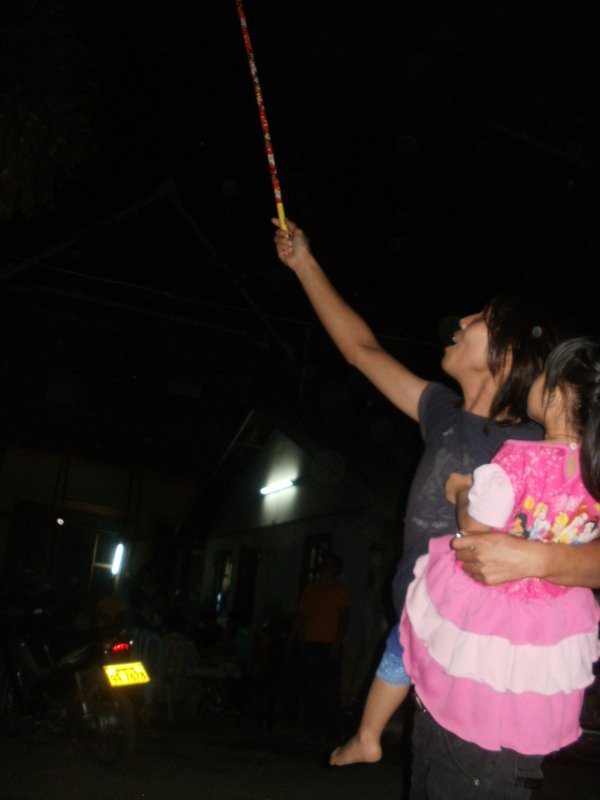Firework in one hand, child in other...why not??